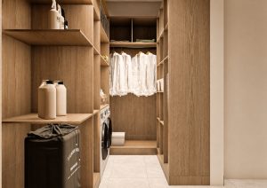 صورة تصميم داخلي لغرفة غسيل حديثة ومرتبة، مع خزائن خشبية مفتوحة.